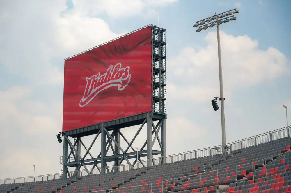 Massive LED stage screens displaying brand logos during finals