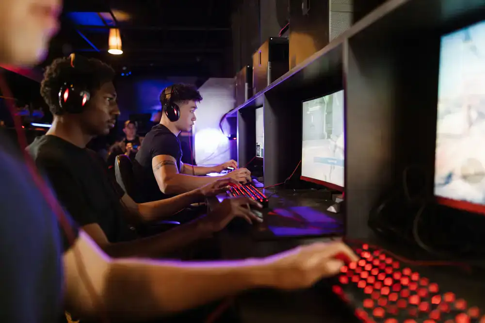 Rows of high-performance gaming PCs at a regional LAN qualifier